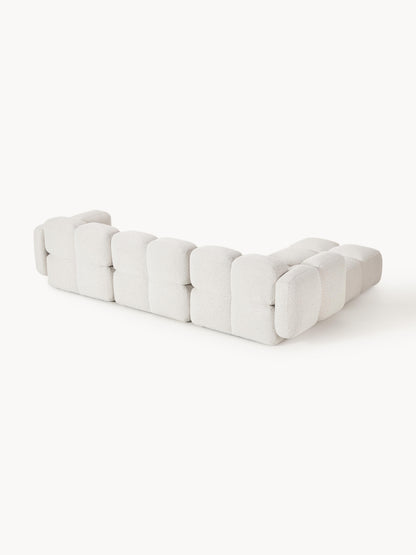 Modulares Sofa Tayla (4-Sitzer) aus Bouclé mit Hocker (links/rechts)