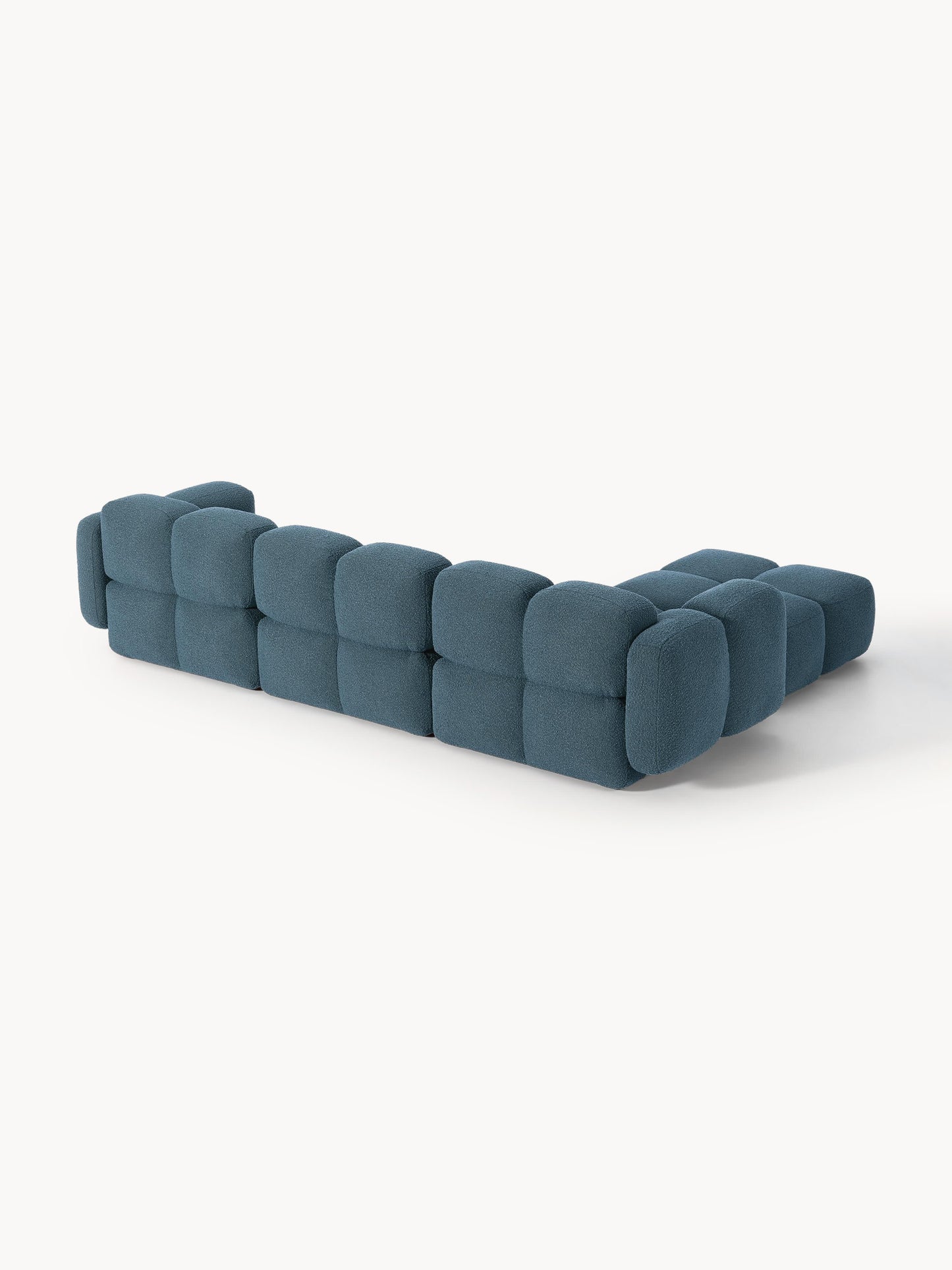 Modulares Sofa Tayla (4-Sitzer) aus Bouclé mit Hocker (links/rechts)