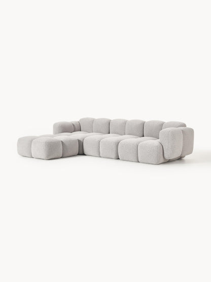 Modulares Sofa Tayla (4-Sitzer) aus Bouclé mit Hocker (links/rechts)