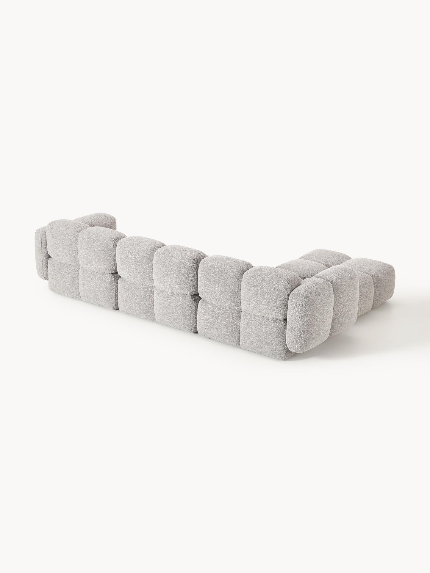 Modulares Sofa Tayla (4-Sitzer) aus Bouclé mit Hocker (links/rechts)