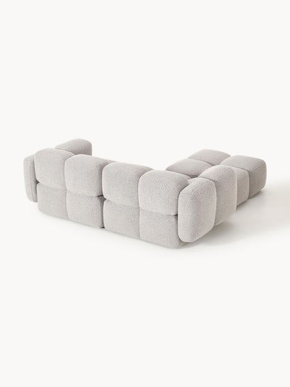 Modulares Sofa Tayla (3-Sitzer) aus Bouclé mit Hocker (links/rechts)