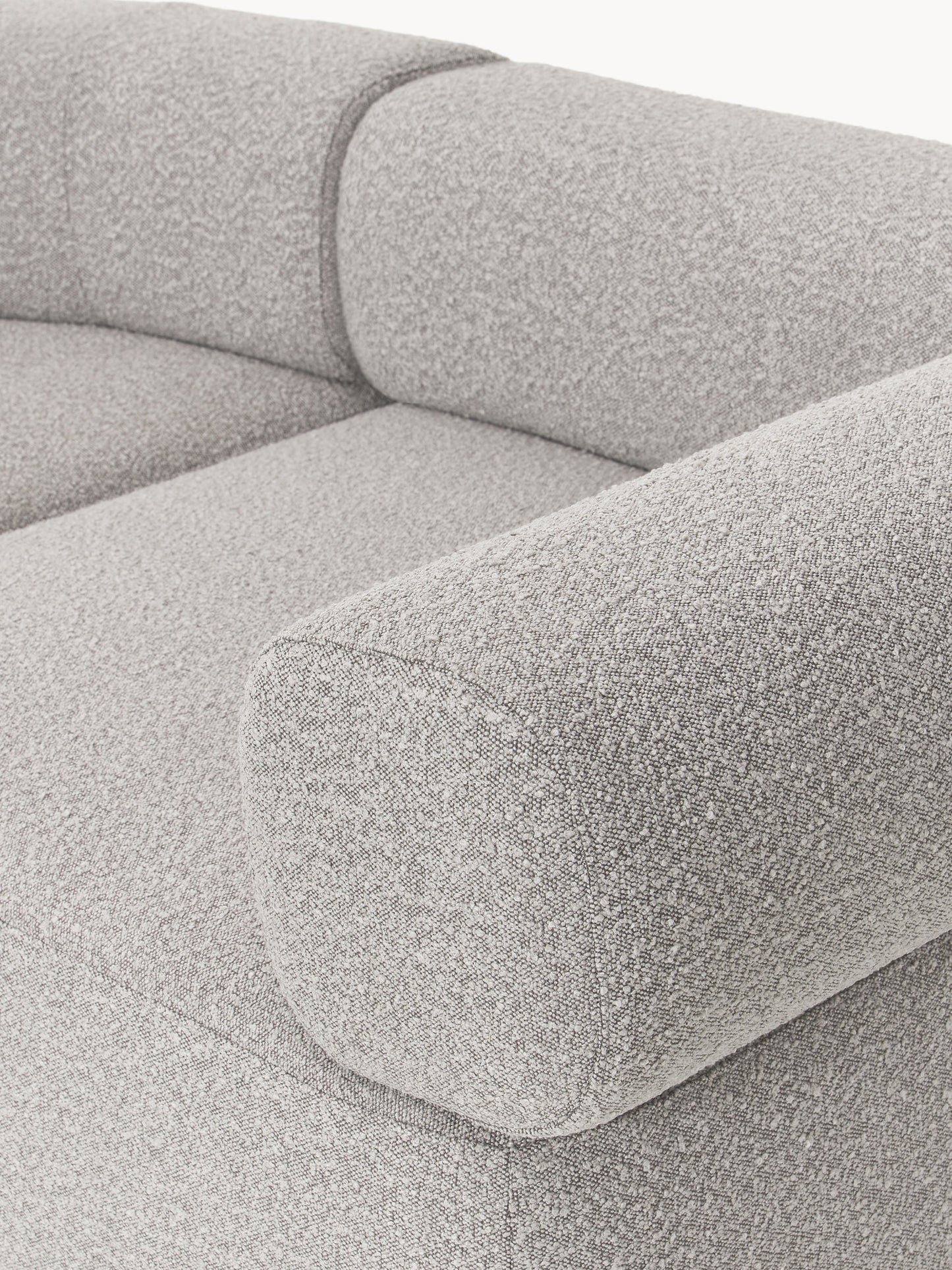 Großes modulares Bouclé-Sofa Anton mit Hocker (links/rechts)